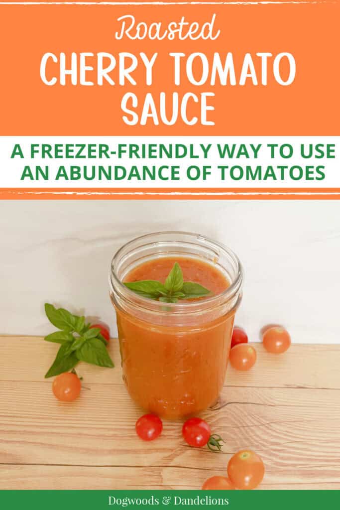 roasted cherry tomato sauce with a sprig of basil surrounded by cherry tomatoes with text "roasted cherry tomato sauce a freezer friendly way to use an abundance of tomatoes