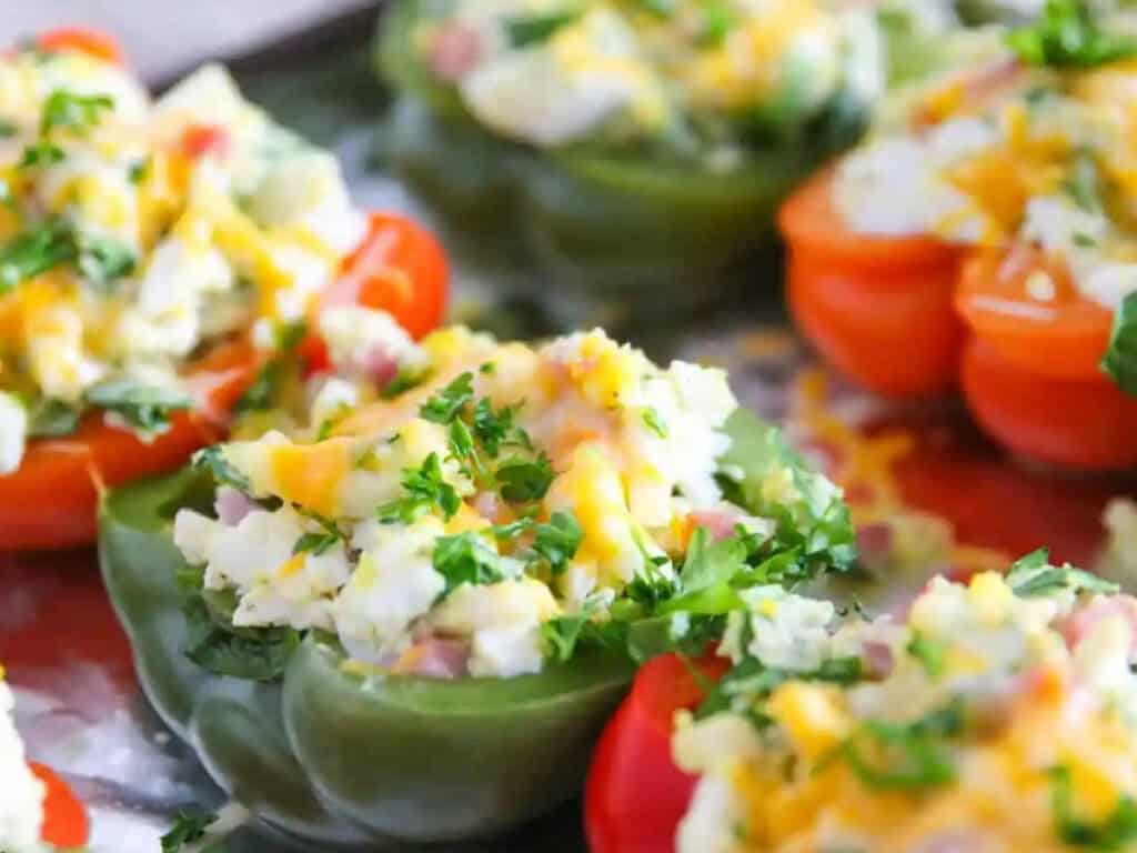 red and green peppers stuffed with hardboiled eggs